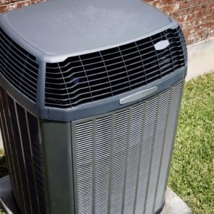 Technician installing a heat pump in Round Rock TX