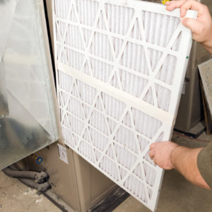 One of our technicians servicing a heating system in Round Rock